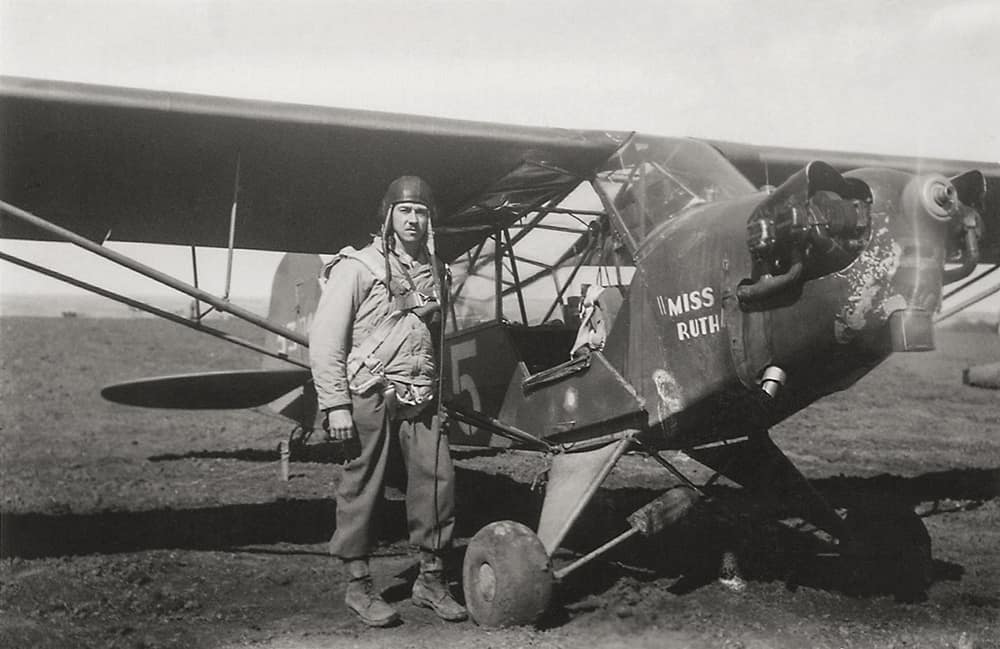 Dad standing by plane WWlll by Dan Cleary in Dayton Ohio