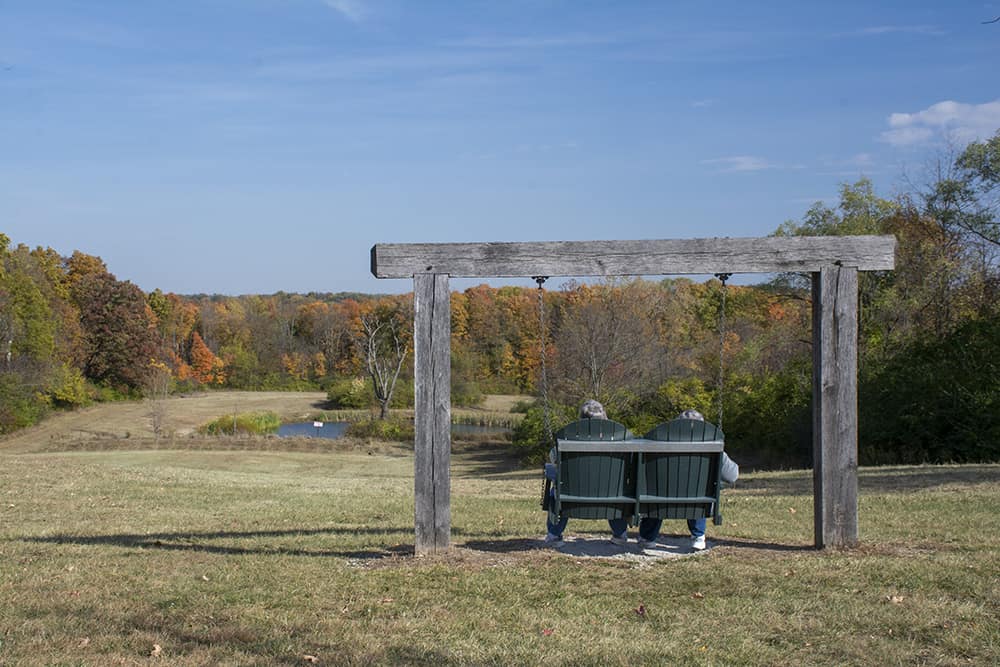 Couple sitting at Taylorsville Metro Park original photo by Dan Cleary of Cleary Creative Photography