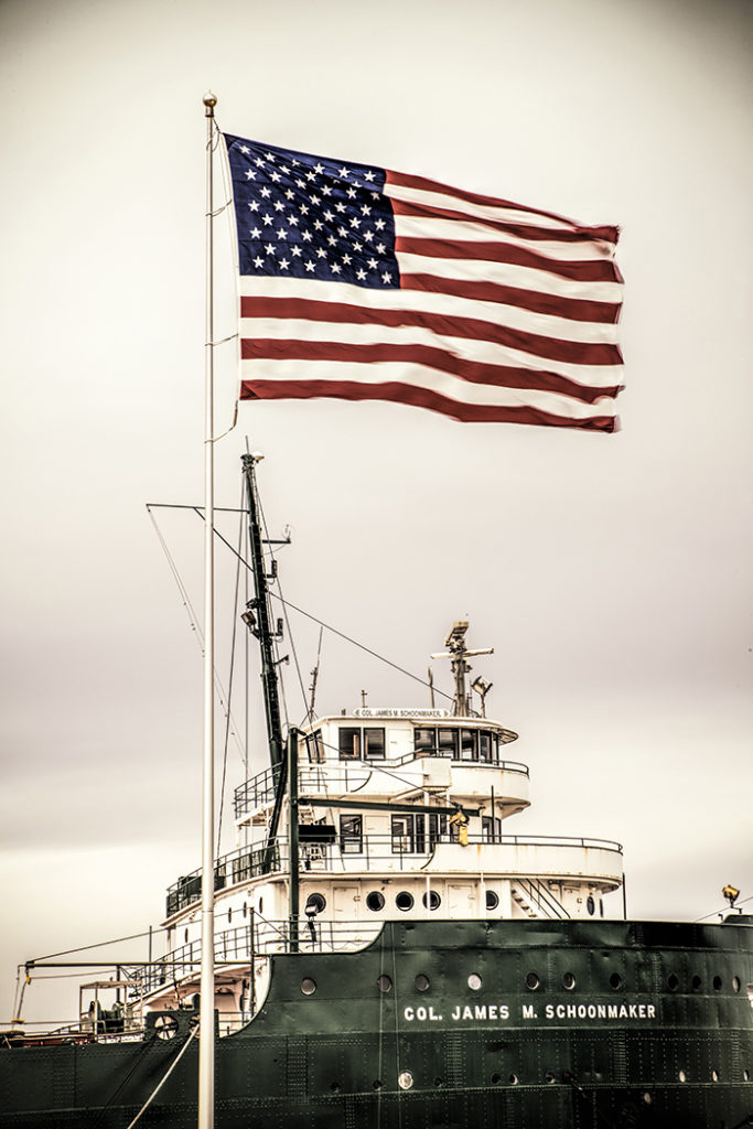 James Schoonmaker freighter with American flag Toledo, Ohio by Dan Cleary